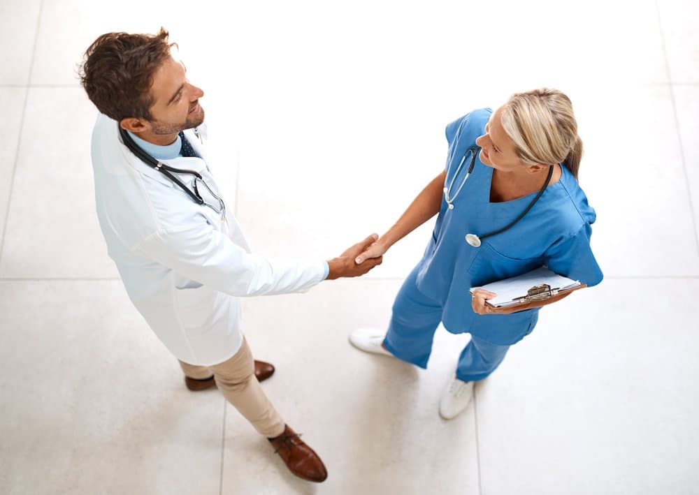 Medical staff shaking hands.